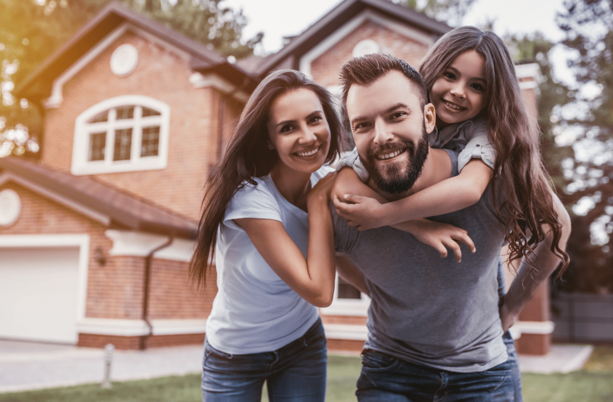 Young family outside their house