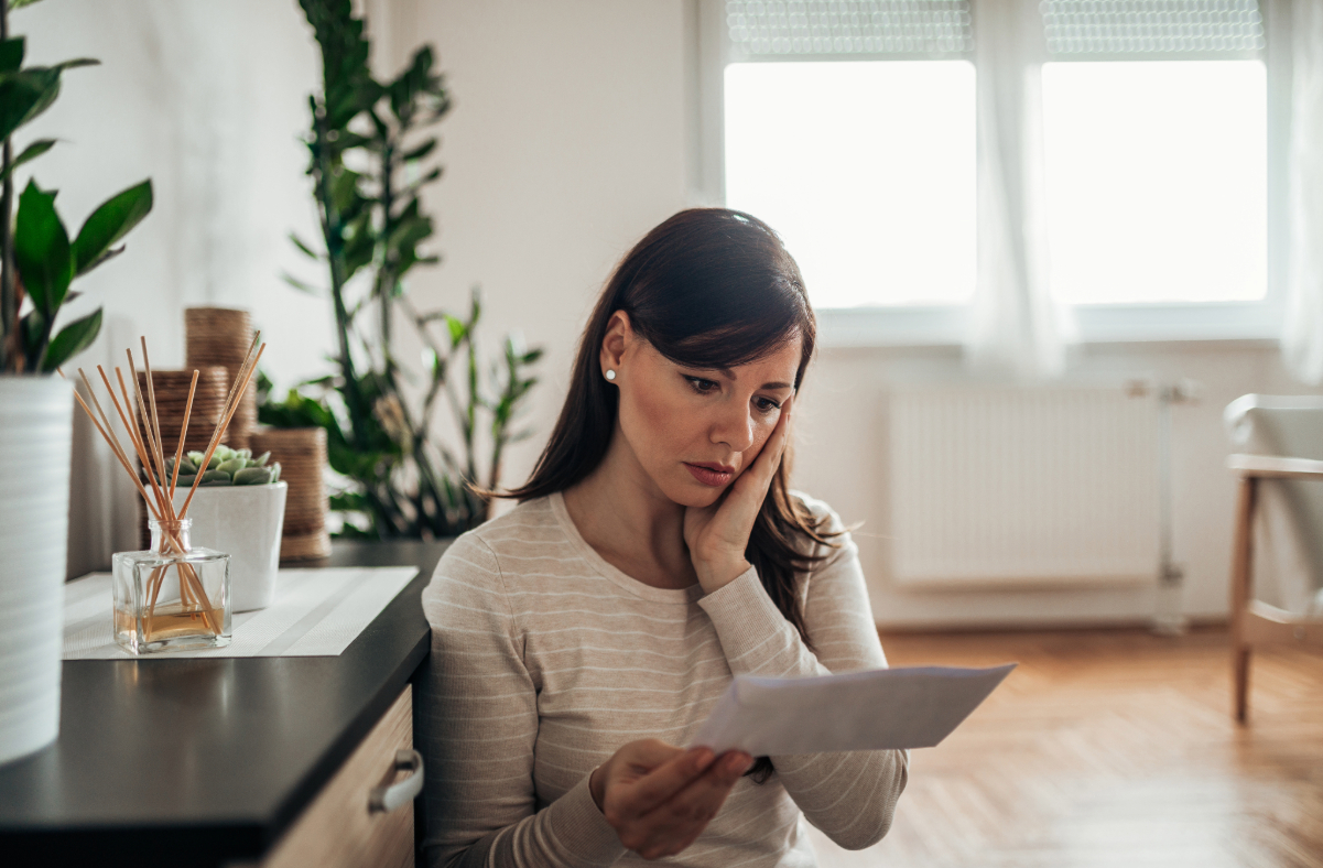 Woman reviewing home insurance document