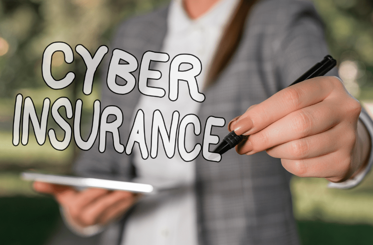 Man holding tablet with cyber insurance graphic