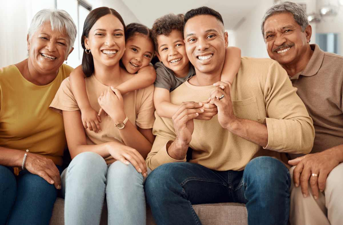 Multigenerational family sitting on couch together