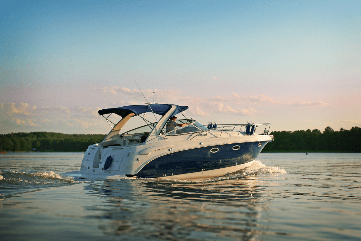 Man driving a boat out on a lake