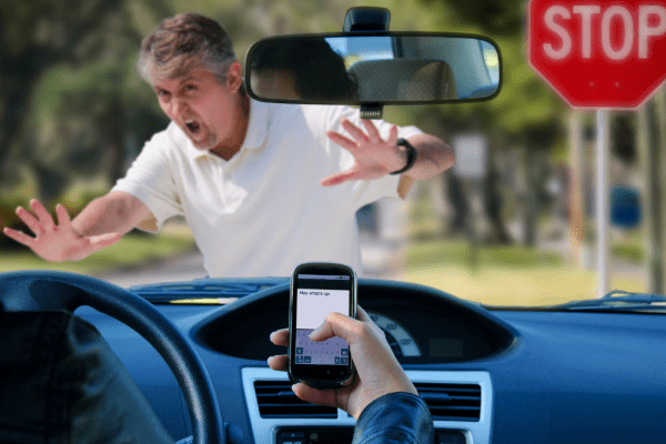distracted driver almost hits pedestrian because they are texting